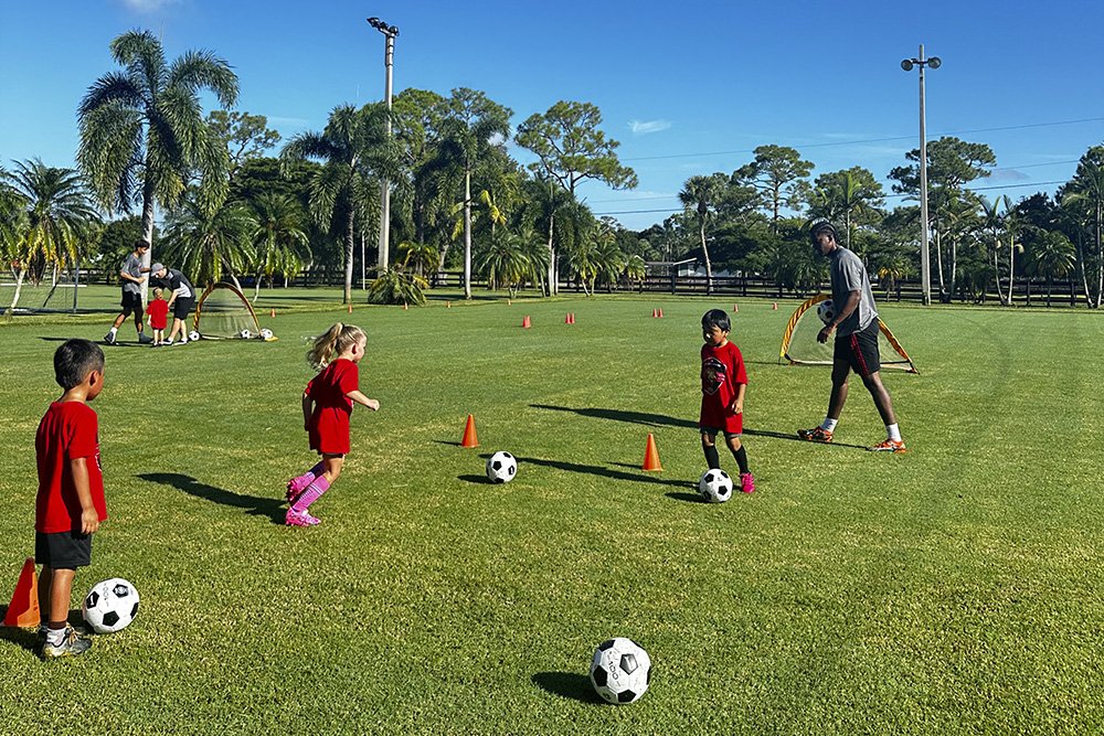 Another child playing soccer