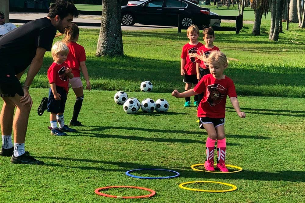 Another child playing soccer