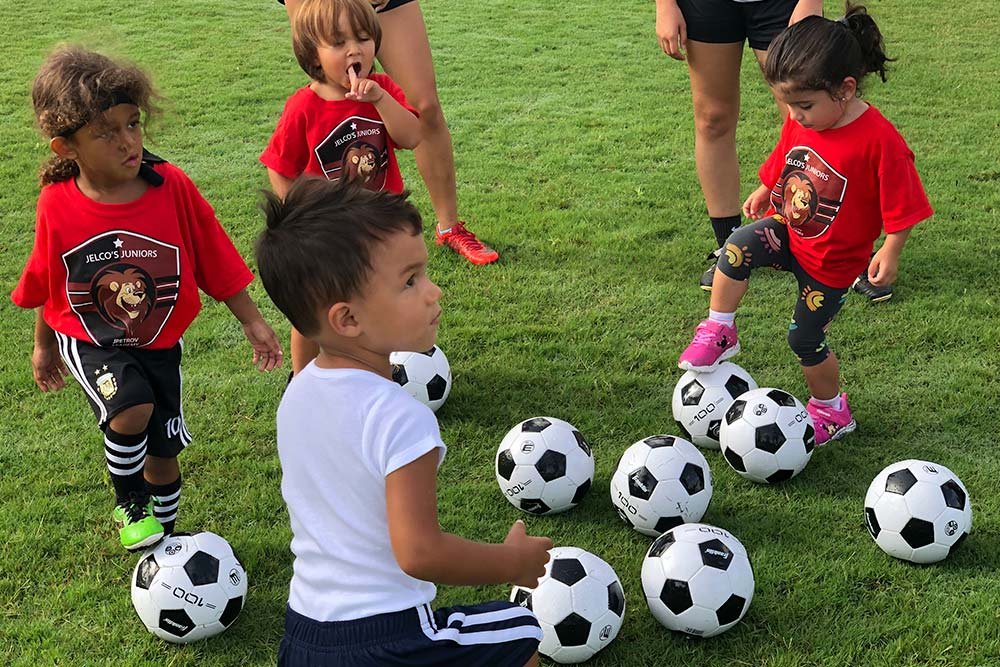 Another child playing soccer