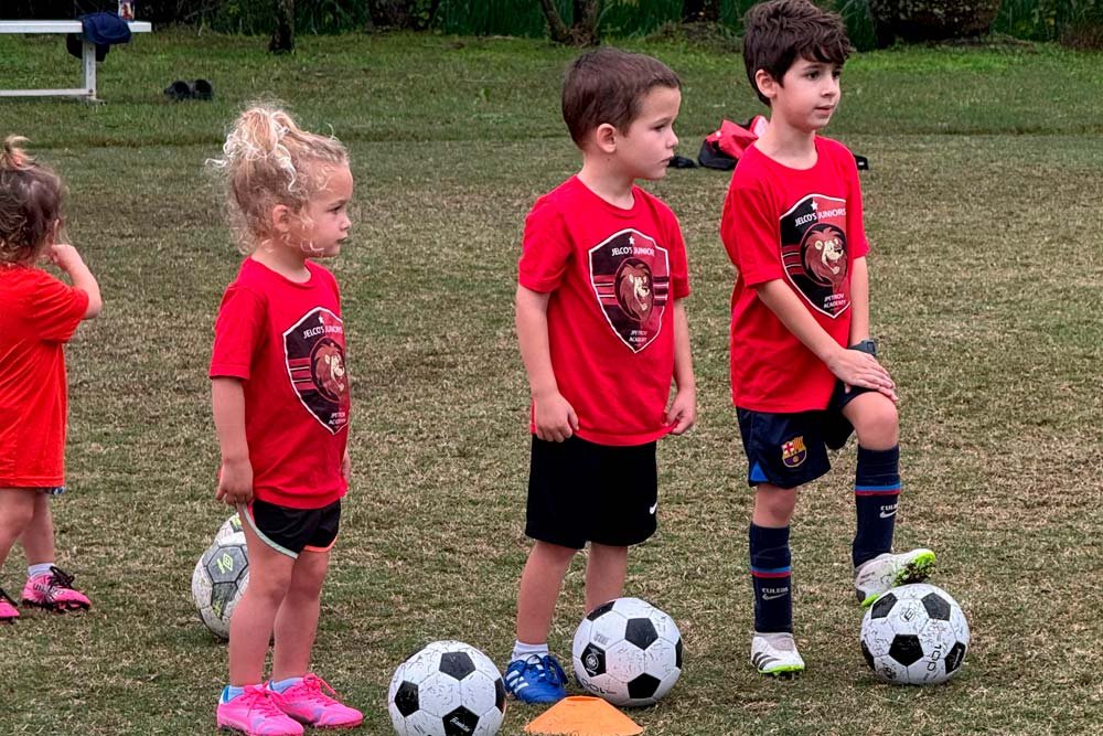 Another child playing soccer